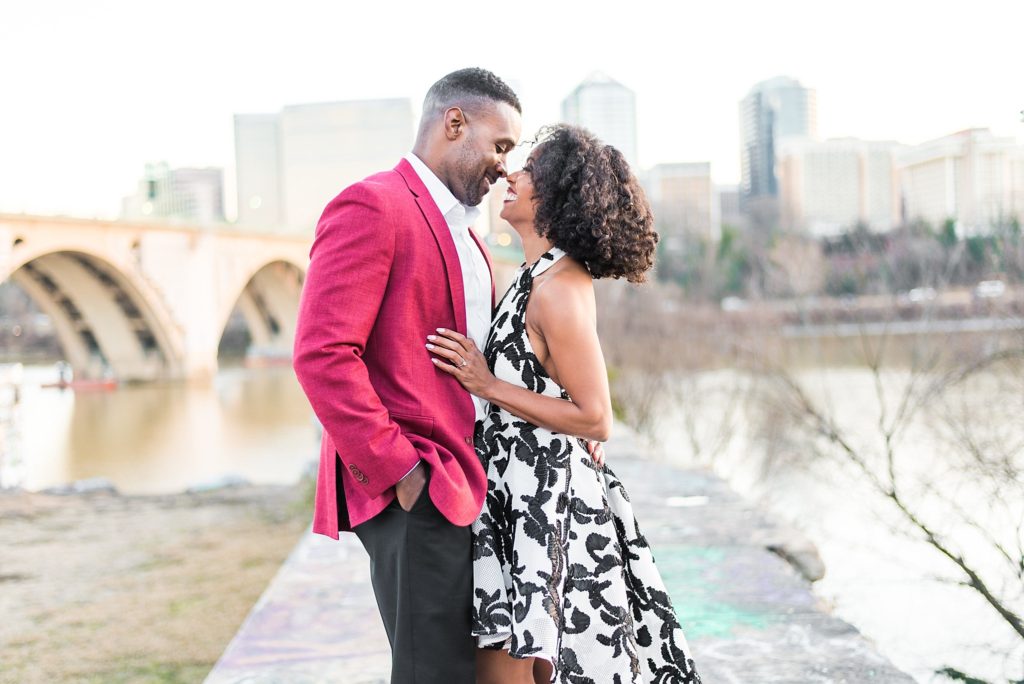 engagement session with couple by bridge